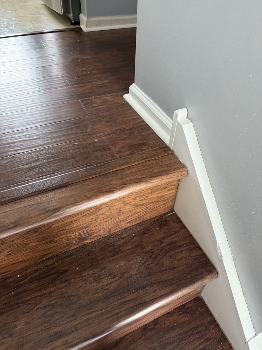 Custom hardwood staircase and marble flooring
